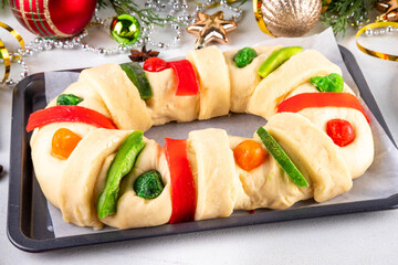 Cooking traditional Mexican Rosca de Reyes, baking for January 6th in honor of Día de los Reyes Magos, Three Kings Bread, fruit flavored sweet bread for Christmas and  Kings Day festivities