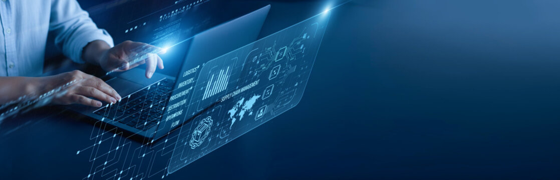 Supply Chain Management network connection concept. Logistics manager hand working on a laptop computer with graphical inventory tracking shipment analytics warehouse coordination, and efficiency. - Powered by Adobe