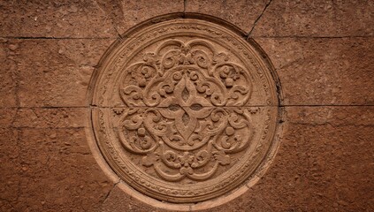Obraz premium Ornamental Stone Circle with Floral Elements Textured Surface Composition.