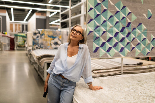 Woman explores beautiful fabric designs in a home decor store during a casual afternoon visit