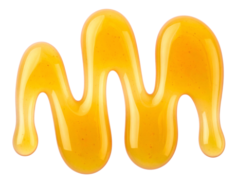 Close-up of golden, viscous liquid drizzled onto a black background in a squiggly line