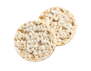 Two round, textured, puffed-grain cakes, close-up, against a stark black background