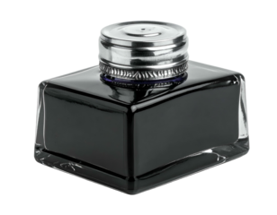 Clear glass inkwell with dark liquid inside, topped with a metallic lid