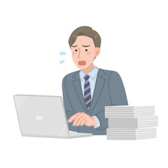 仕事が溜まっているビジネスマン