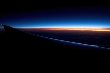 Airplane Wing at Sunset Above Clouds Aerial View from Plane Window Travel Photography Dark Blue Sky