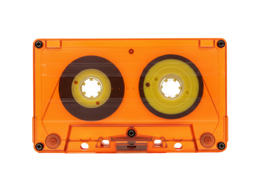Isolated orange cassette tape on a seamless backdrop for music and sound recording