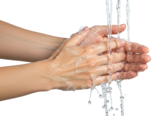 Isolated closeup of hands being washed under running water for hygiene in a health context