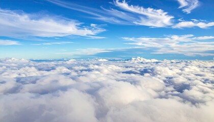 Aerial View Above White Puffy Clouds Against a Vivid Blue Sky with Wispy Cirrus Cloudscape