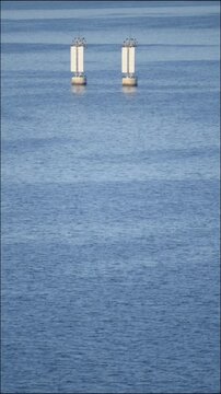 Two large buoys on the river, navigational objects, blue water of the Dnieper River.
