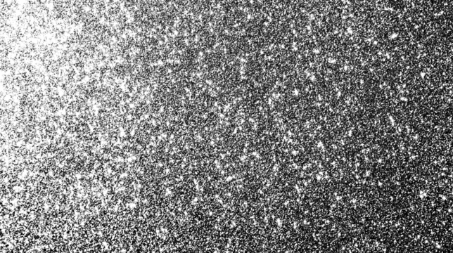 Dense grain texture with a gradual light-to-dark gradient and scattered noise particles on a transparent background.