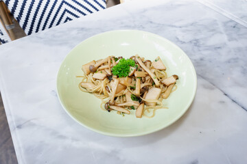 A delicious plate of pasta with mushrooms and parsley