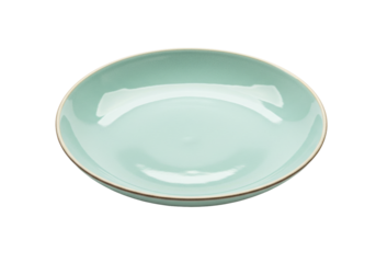 Isolated teal plate or dish with brown rim on a plain surface, kitchenware, ceramics