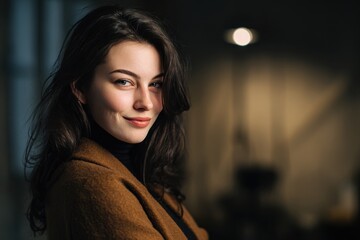Fototapeta premium Portrait of a woman in a brown coat in a cozy dimly lit indoor setting