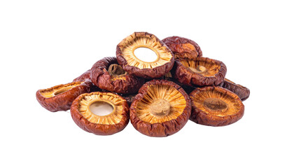 Pile of dried shiitake mushrooms with light tan gills, brown tops, isolated against black