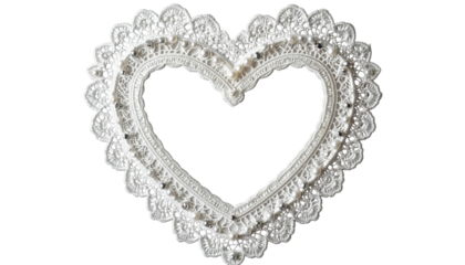 Lacy, white heart frame with scalloped edges, set against a black backdrop, suggests romance or celebration