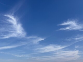 Blue sky with soft clouds.