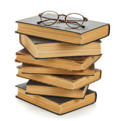 A stack of four old books with yellowed pages and a pair of glasses on the top book