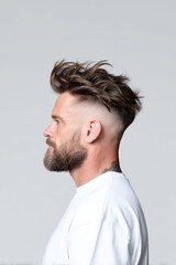 Obraz premium Stylish Side Profile of a Man with Trendy Hairstyle and Beard