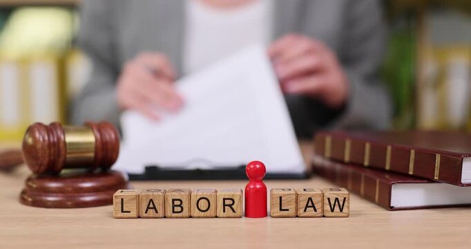 Exploring labor law in a modern office setting during a busy afternoon meeting with documents and legal symbols