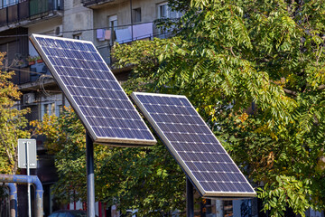 Solar panels on poles outside in park during sunny day
