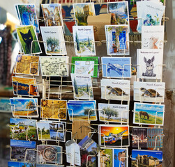 rack with different postcards from Cyprus at the souvenir shop