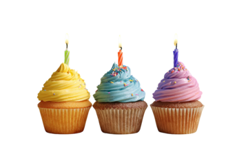 Three cupcakes with colorful frosting and lit candles, against a black background