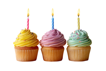 Three cupcakes with brightly colored frosting and lit candles, isolated on transparent background