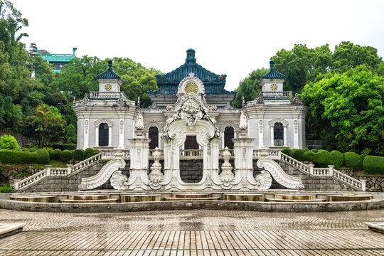 Stunning traditional building stands amid lush greenery in New Yuan Ming Palace