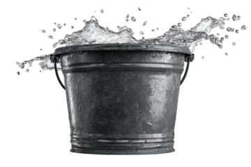 A galvanized metal bucket, filled with water, experiences a splash, set against a dark background