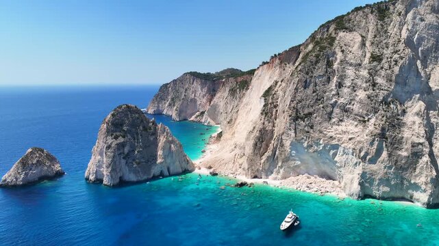 Aerial drone cinematic video from scenic viewpoint to small iconic islets of Mizithres a true paradise tourist place visited by yachts and sail boats in island of Zakinthos, Ionian Sea, Greece
