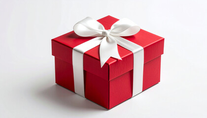 Obraz premium Red gift box with white bow on white background isolated. New Year or Christmas gifts. Birthday or Valentine's Day