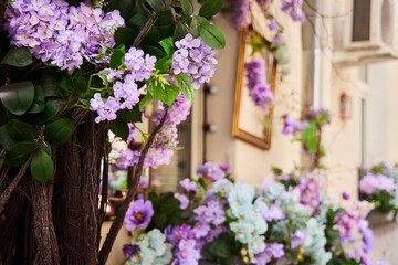 Floral decoration on the facade of the building on the city street