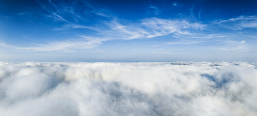 Magnificent sea of clouds under a deep blue sky