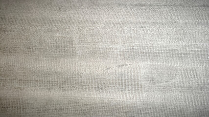 Gray textured fabric with subtle horizontal and vertical patterns creating soft look