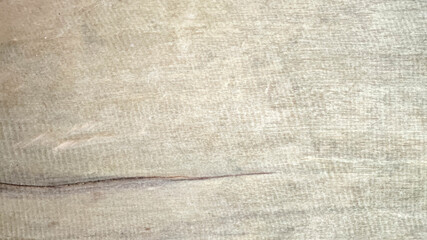 Soft beige fabric texture with subtle lines and gentle crease creating calm feeling
