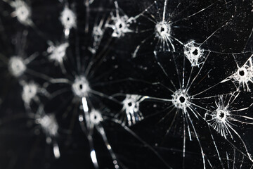 Bullet holes on black glass, overlay design background
