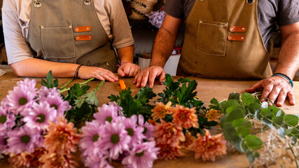 Small business florists arranging fresh flowers for customers