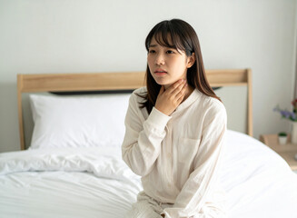 寝起きで喉が痛い女性
