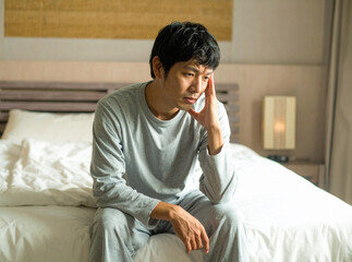 寝起きで体調不良の男性