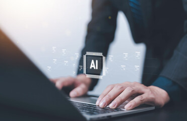 Businessman using laptop with artificial intelligence icon and data network, symbolizing AI technology, digital innovation, machine learning, automation, and future business transformation concept.