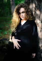 Mysterious woman in nature - embracing shadows.