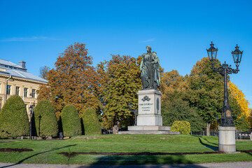 The historic statue of King Karl IV Johan in public park Carl Johans Park during autumn in Norrköping. Norrköping is a historic industrial town in Sweden.