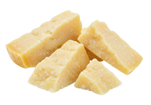 Isolated chunks of delicious Parmigiano Reggiano cheese on a plain surface, ready for grating.
