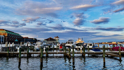 Marina at sunset in Old Town Alexandria Waterfront area with boats, docks, and tranquil water
