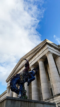 Dc Usa neoclassical building with a vibrant sculpture in DC USA. Smithsonian American Art Museum.  SAAM