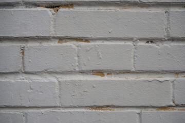 Closeup brick wall painted with gray paint. Old  bricks wall texture background. Stonework close up. Backdrop for interior or exterior design projects