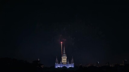 Igniting pyrotechnic shells launching and bursting above lit historic building at night with embers - Powered by Adobe