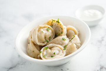 Russian dumplings served with sour cream
