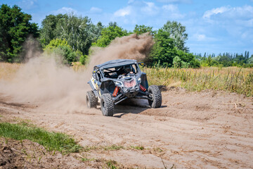 Fototapeta premium Cool view on hard ride UTV, ATV, 4x4 in sandy road