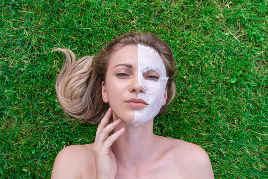 Close up of young woman with face mask in grass. Spa, healthy, naturally. Healthy lifestyle concept